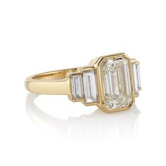 Single Stone Caroline Ring features an emerald-cut diamond center with baguette-cut diamond accents bezel-set in a handcrafted 18K yellow gold mounting. Total center diamond weight: 2.02 ct GIA Certified Shape: Emerald-Cut Color: L Clarity: IF Total accent diamond weight: 0.66 ct Shape: Baguette Ring size: 6 Excluded from all discounts and promotions. Single Stone Ring, Emerald Cut Diamond, Engagement Ring Sizes, Baguette Cut Diamond, Single Stone, Stone Engagement Rings, Antique Diamond, Fine Jewelry Collection, Emerald Cut Diamonds