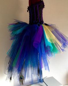 a dress made out of colorful tulleries on a mannequin headdress