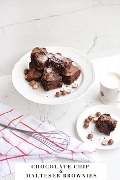 chocolate brownies on a plate with a whisk next to it and a glass of milk