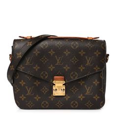 This is an authentic LOUIS VUITTON Monogram Pochette Metis. This chic handbag is finely crafted of classic Louis Vuitton monogram toile canvas. The bag features a vachetta cowhide leather handle, an optional, adjustable monogram coated canvas shoulder strap, and a rear zipper pocket. The crossover flap opens with a polished brass S-lock to a partitioned brown microfiber interior. Louis Vuitton Monogram Bag, Louis Vuitton Pochette Metis, Louis Vuitton Crossbody Bag, Louis Vuitton Crossbody, Louis Vuitton Empreinte, Louis Vuitton Vernis, Louis Vuitton Pochette, Monogram Bag, Chic Handbags