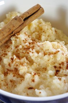 a white bowl filled with mashed potatoes and cinnamon