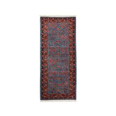 a blue and red rug with an intricate design on the bottom, in front of a white background