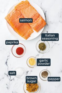 ingredients for salmon seasoning laid out on a white marble counter top with the words salmon seasoning written in different languages