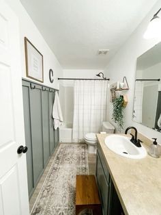 a bathroom with a sink, toilet and shower in it's own home area