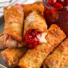 cherry cheesecake pastries on a plate with jam