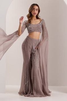 Mauve padded blouse, embellished by crystal, bead wave motifs. Comes with embellished flared pant. - Aza Fashions Blouse Organza, Wedding Guest Attire, Pant For Women, Vacuum Storage, Flare Pant, Guest Attire, Grey Blouse, Embellished Blouse, Sleeves Blouse