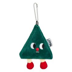 a keychain with a green triangle shaped object hanging from it's side