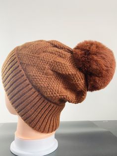 Fits both teenage girls and adult ladies. With their stretchy construction, the fleece lined hat is one-size-fits-most. Material: 70% Acrylic, 30% Wool Full Fleece Lining inside which will keep you warm and cozy. The pom pom is made of faux fur and has the soft touch. It's suitable for everyday wear and will be the perfect gifts . Warm Bonnet Cap For Fall, Warm Fall Bonnet Cap, Warm Winter Bonnet Beanie, Warm Winter Hats One Size, Winter Soft Knit Bonnet Cap, Winter Soft Knit Cap Bonnet, Solid Bonnet For Cold Weather One Size, Knitted Winter Bonnet Cap, Solid Bonnet For Cold Weather