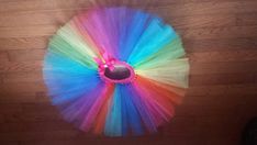 "Your little lady will look and feel like a princess in this beautiful rainbow tulle tutu I make each tutu with two full layers of tulle and I use over 75 yards of premium quality tulle for all of my tutus so they will be extra full and fluffy (Smaller (shorter) sized tutus will look a lot more full than longer ones). colors in tutu are Orange Yellow Green Aqua Royal blue Purple Fuschia I love custom orders and your ideas are always welcome..please send me a conversation! I use an elastic croche Playful Rainbow Tulle Tutu Dress, Whimsical Rainbow Tutu Dress For Birthday, Multicolor Tulle Tutu Dress For Birthday, Multicolor Princess Tutu Dress For Cake Smash, Cute Multicolor Tutu Dress For Cake Smash, Princess Style Multicolor Tutu Dress For Cake Smash, Cute Multicolor Tulle Tutu Dress, Rainbow Tutu Dress For Birthday, Cute Rainbow Tutu Dress For Birthday