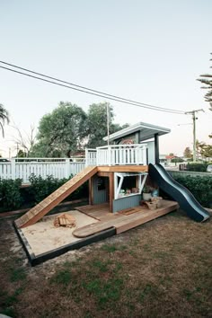 a house with a slide in the yard