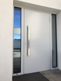 a white door with two sidelights on the outside