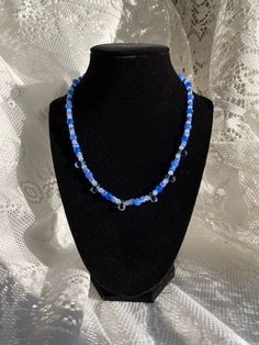 Blue Grotto - a OOAK Unique Beaded Necklace! Made with a mix of blue millefiori and blue glass beads. Necklace Length: 16 in with 1.5 in extension KEEP IN MIND ✦ Some colors may look a little different in person vs in pictures. ✦ Since my products are handmade, each one is unique, and there could be small differences with the original photo, especially with the resin jewelry. ✦ If you have any other questions or comments please contact me! Blue Glass Beaded Bohemian Necklace, Blue Glass Bohemian Beaded Necklaces, Bohemian Blue Glass Beaded Necklaces, Bohemian Blue Glass Beads, Blue Beaded Czech Glass Necklaces, Blue Czech Glass Beads For Beach, Blue Czech Glass Beaded Chain, Blue Glass Round Bead Necklaces, Blue Czech Glass Necklaces With Round Beads