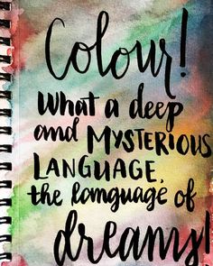 a spiral notebook with the words color, what a deep and mysterious language is the language of dreams