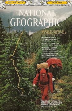 the front cover of national geographic magazine showing two men hiking in the woods