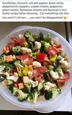 a white plate topped with broccoli, cauliflower and peppers