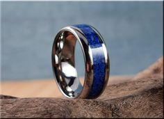 This is a beautiful, handcrafted Artisan ring made in my small shop in Ottawa, Ontario, in Canada. This beautiful ring holds a stunning Lapis Lazuli stone inlay on a titanium comfort fit core. US full and half ring sizes from 5 - 13 are available, in widths of 4mm, 6mm, and 8mm. If you require a custom order at a different size, please send me a message and I will do my best to accommodate.  NOTES: Shown in 8mm comfort fit width. A luxurious, solid Walnut box with logo is available as a presenta Round Rings With Inlay Perfect For Gifts, Gift Round Ring With Inlay, Artisan Promise Ring, Channel Ring, Printable Ring Sizer, Lapis Ring, Ottawa Ontario, Artisan Rings, Lapis Lazuli Stone