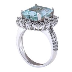 Stamped: 14K White Gold Total Ring Weight: 8.0 Grams Gemstone Weight: Total Natural Aquamarine Weight is 4.88 Carat (Measures: 12.05x10.00 mm) Color: Blue Diamond Weight: Total Natural Diamond Weight is 0.70 Carat Quantity: 56 Color: F-G, Clarity: VS2-SI1 Face Measures: 19.65x17.90mm Sku: [702085W] Aquamarine Brilliant Cut Diamond Ring For Formal Occasions, Luxury Aquamarine Diamond Ring With Prong Setting, Luxury White Gold Ring With Aquamarine, Formal Aquamarine Diamond Ring With Brilliant Cut, Luxury White Gold Aquamarine Ring, Luxury Emerald Cut Gemstones For Anniversary, Luxury Cushion Cut Gemstones With Prong Setting, Luxury Aquamarine Rings With Prong Setting, Luxury Emerald Cut Gemstone Halo Ring