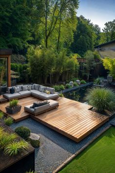 an outdoor living area with couches, tables and water feature in the middle of it