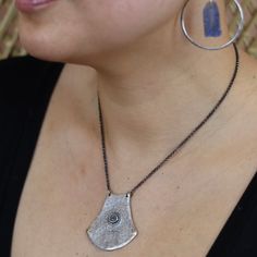 This hammered, rustic shape has a carved spiral in its center and brass rivets. It is part of my new Modern Relics 2015 collection. Perfect for the warrior in us all! A great statement piece on it's own or it can be layered. It also comes in brass. It hangs on an oxidized, adjustable 16-18" sterling chain. *These sale items are final and are not eligible for returns or exchanges. Hammered Brass Spiral Jewelry, Artisan Hand Forged Festival Necklaces, Artisan Hand Forged Necklaces For Festival, Unique Hammered Spiral Jewelry, Rustic Hammered Brass Jewelry, Artisan Hammered Brass Necklace, Artisan Brass Necklace With Hammered Detail, Artisan Brass Hammered Necklace, Unique Hammered Jewelry For Festivals