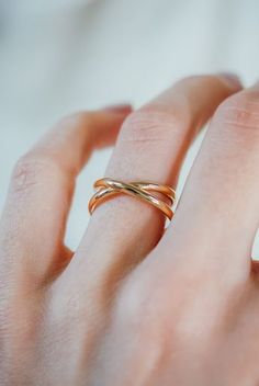 Our ‘X’ ring design in a smooth, thick metal. The Infinity X-Ring is what happens when we merge the X-Ring and the Infinity Spiral Ring! ONE SINGLE Ring in SOLID 14K GOLD. EXTRA THICK, SMOOTH FINISH. To make this style, we wrap a length of thick, D-shaped metal to create a simple criss-cross ‘X’ design before soldering it securely on the back. Every piece is organic and unique — no two Hannah Naomi pieces are exactly alike.Hand-crafted to order in our Portland, OR studio.