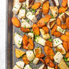 roasted carrots and potatoes on a baking sheet