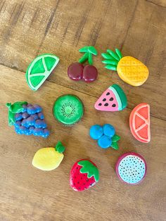 there are many different fruits and vegetables made out of play doughs on the table