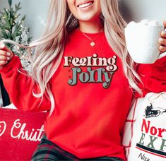 Feelin' Jolly Christmas Sweatshirt, Festive Christmas Sweater, Feelin' Jolly Christmas Sweater, Christmas Shirt, Jolly Holiday Shirt,  Christmas Jumper  Feelin' Jolly Christmas Sweatshirt is perfect for the holidays. Printed with water-based ink and featuring a festive Feelin' Jolly design on the front. The fit is true to size and comfy. Soft, cozy fleece interior. Enjoy free shipping USA. Be Cozy. Feelin' Jolly Christmas Sweatshirt 50% cotton, 50% polyester Medium-heavy fabric  Loose fit  true Holiday Sweatshirts, Gingerbread Bakery, Christmas Crewneck Sweatshirt, Cricut Shirts, Christmas Clothing, Womens Christmas Shirts, Christmas Hoodie, Silhouette Ideas, Tshirt Ideas