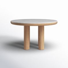 a round table with two wooden legs and a white marble top on an isolated background