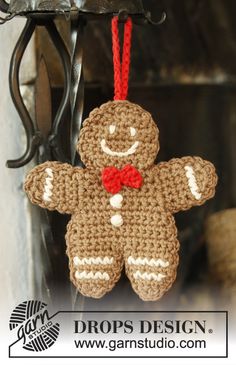 a crocheted ginger ornament hanging from a hook