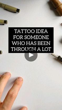 a person's hand is pointing at the top of a piece of paper that says, tattoo idea for someone who has been through a lot