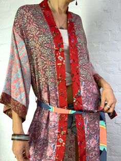 "This is colourful long silky robe made patchwork maxi long with pockets and split, easy to wear wrap tie closing made free size real boho cover up, perfect to wear on its own or layered ower jeans and tshirt length 54\" more available at https://www.etsy.com/shop/AltheaStores?ref=seller-platform-mcnav Thank You for looking" Bohemian Festival Kimono With Tie Waist, Spring Beach Kimono With Patchwork, Spring Festival Kimono With Patchwork, Long Patterned Kimono For Festival, Long Patterned Festival Kimono, Bohemian Wrap Robe With Floral Print, Summer Bohemian Robe With Tie Waist, Multicolor Floral Print Wrap Robe, Multicolor Silk Robe For Spring