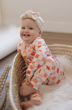 Your new favorite pajama for your sweet little babe! This double zipper romper is made out of 95% bamboo viscose; 5% spandex. Our rompers have the option to fold over the feet to keep your little one warm at night. These comfy rompers can be worn to bed or worn as a daily outfit! These are true to size with the perfect amount of stretch. 0-3 months and 3-6 months will include fold over mittens Wash Instructions: Wash in cold water on gentle cycle. Dry on low heat/gentle cycle. Do not wash with items that have zippers, buttons, snaps, etc to avoid any damage to your Behold Baby item. Pink Checkerboard, Comfy Romper, Wrap Romper, Baby Wraps, Baby Registry, Baby Wearing, Fold Over, Baby Items, Daily Outfits