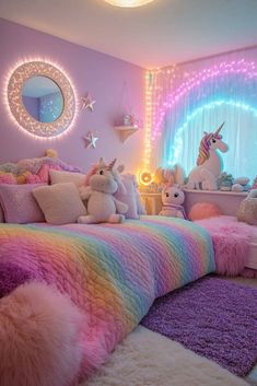 a bedroom decorated in pastel colors with unicorns on the bed and rugs