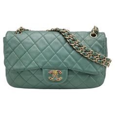 Chanel Classic Flap 2011 Large Teal Green Gem CC Turn lock These are professional photos of the actual bag offered by Luxbags. Chanel Timeless / Classic Flap in gorgeous teal green lambskin leather with gold-tone hardware. This rare find is adorned with gem embellished CC turn lock. The chain strap is a double chain style but joined together to be worn as a single chain. CONDITION: VERY GOOD Minor overall hardware wear.Minor wear to the entire body, moderate stains to the interior. Slight stains Teal Green Color, Structured Shoulder, Green Gem, Professional Photos, Green Maxi, Chanel Vintage, Green Gems, Double Chain, 2024 Fashion