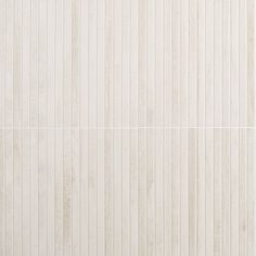 a white wall with vertical lines on it