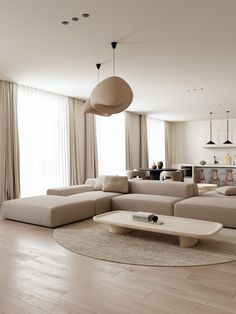 a living room filled with furniture and a large window