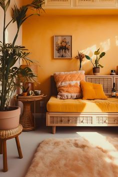 a living room filled with furniture and plants