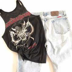 This was a men's Metallica Fan Club tee that was reworked into a small women's tank. It's one of a kind. There is a rip in the lower front that was used to tie the bottom of the shirt with. I've provided measurements in the photos for an accurate fit. It's the perfect true vintage Metallica fan tee to partner with your trashed hi rise 90's jeans and your docs. And it's already reworked and custom cut ⚡️ (14) Casual Streetwear Tops With Tank Straps, Casual Graphic Print Tank Top, Casual Tank Strap Tops For Streetwear, Graphic Print Racerback Top For Streetwear, Casual Tank Top For Streetwear, Punk Style Cotton Crew Neck Tank Top, Casual Graphic Print Tank Top For Concert, Punk Crew Neck Tank Top For Concerts, Punk Style Crew Neck Tank Top For Concerts