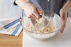 a person is mixing ingredients in a bowl