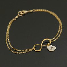 "\"INFINITY\" symbolizes never ending love (or friendship)for \"LOVE\" is infinite, ageless and boundless. A romantic Infinity (figure eight) charm is the focal of this bracelet, adorned by a petite heart charm with your choice of a single initial and a single birthstone. Personalize this piece and make it a special keepsake for yourself or your love ones. ♥ 20x8mm 24K Gold Vermeil* (*gold over .925 Sterling Silver) INFINITY charm with matte finished. ♥ 8.5mm (20ga) w/1mm thickness HEART charm a Infinity Heart Bracelet For Anniversary, Friendship Infinity Bracelets For Mother's Day, Adjustable Infinity Jewelry For Valentine's Day, Adjustable Infinity Heart Bracelet For Mother's Day, Elegant Name Bracelet With Initials For Friendship, Elegant Initials Name Bracelet For Friendship, Personalized Infinity Bracelets For Friendship, Elegant Adjustable Heart Bracelet For Birthday, Hypoallergenic Infinity Bracelet For Mother's Day