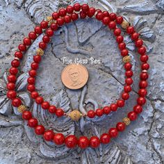 DESCRIPTION: Thank you for coming in! Beautiful rare Mediterranean Sardinia Coral with OX blood red color and sphere shape! The color is directly from the ocean, not dyed! 100% natural beauty! 28 inch necklace with 18k solid gold diamond spacers and clasp! Manufactured in Italy! 327 carats! You'll get the necklace you see! SIZE of the coral : Appr.7.5mm-11.5mm COLOR: OX Blood Red GRADE: AA Red Artisan Necklace With Round Beads, Artisan Red Necklace With Round Beads, Formal Red Coral Beaded Necklace, Red Coral Hand-strung Necklace, Luxury Red Necklace With Polished Beads, Red Coral Jewelry With 8mm Beads, Red Oval Beads Spiritual Necklace, Red Round Beads For Formal Occasions, Traditional Red Single Strand Necklace