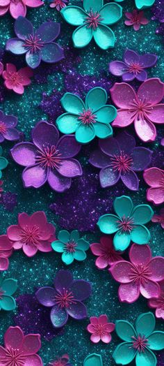 purple and blue flowers are floating in the water with glitter flakes on it's surface