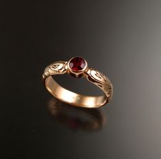 "This pretty ring has a Victorian antique look with a 3.75mm round Ruby red Pyrope anthill Garnet. These screaming red Garnets are brought to the surface by ants and collected by Native Americans in Arizona. These are about as large as they ever get (about .25ct) Set in 14k rose Gold The band is 4mm wide and 1.5mm thick. Specify your size in a \"note to seller\" at check out." Outfit Claims, Vintage Garnet Ring, Antique Ruby Ring, Garnet Wedding Rings, Garnet Ring Vintage, Garnet Wedding, Ruby Ring Gold, Cute Engagement Rings, Hogwarts Aesthetic