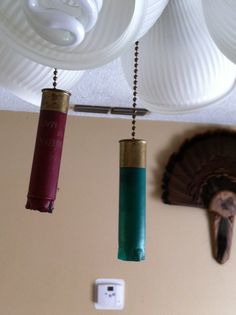 three lights hanging from the ceiling in a room