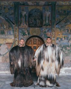 two men in furry costumes standing next to each other