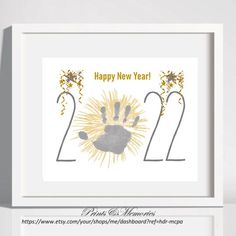 a happy new year card with a handprint in the shape of a sunflower