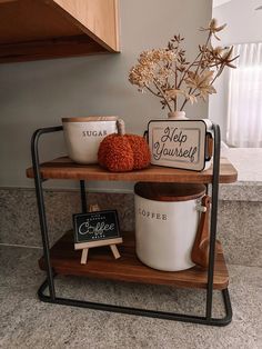 a shelf with coffee mugs and other items on it