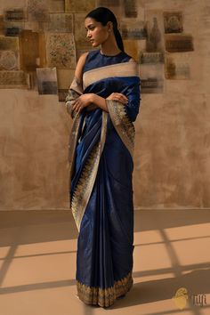 "\nAamodini\nAn enchanting delight, whose every inch is fragrant with everlasting artistry.\u00a0This is an exquisitely detailed,\u00a0classical\u00a0drape.\u00a0A beautiful plain silken body, set against conscientiously designed floral meenakari borders and pallu; a truly\u00a0graceful interpretation of Banarasi artistry.\u00a0\n\u00a0\n\n\nColor\u00a0-\u00a0A\u00a0stunning\u00a0shade of\u00a0Midnight Blue\n\nTechnique\u00a0-\u00a0An enduring Kadwa weave and fine Meenakari technique. The elaborate and laborious Kadwa (Kadhua) technique involves hand-weaving each motif separately. It takes longer on the handloom, but makes a more robust pattern, which stands out on the fabric. Meenakari involves the painstaking addition of supplementary coloured resham threads during the hand-weaving proce Sarees Poses, Classic Saree, Nauvari Saree, Desi Love, Handloom Fabric, Traditional Saree, Sketches Dresses, Blue Saree, Katan Silk