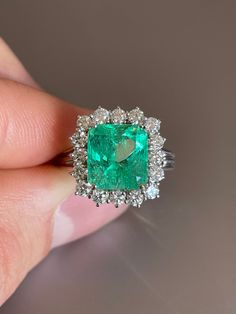 Looking for a proposal ring? In this case with this outstanding 18k white gold emerald ring you're not getting anything but a YES!! Otherwise you're simply buying yourself and outstanding piece of jewelry and a safe investment. 3.83 ct High quality Colombian emerald  flanked with 0.77 ct VS white round diamond in an elegant 18k white gold set. The investment grade quality emerald displays a beautiful bright green color, great luster and clarity. Part of "the big 4" (emerald, ruby, diamond, sapph Luxury Green Oval Diamond Ring, Luxury Heirloom Oval Emerald Ring, Luxury White Gold Emerald Ring For May Birthstone, Luxury Tsavorite Engagement Birthstone Ring, White Gold Emerald Ring, The Big 4, Emerald And Diamond Engagement Ring, Gold Emerald Ring, Oval Halo Engagement Ring