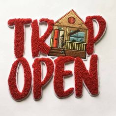 the words take open are made out of red yarn and paper with an image of a house